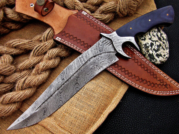 "Mastercrafted Damascus Hilt Fighter: Handcrafted Hunting Knife for the True Outdoorsman"