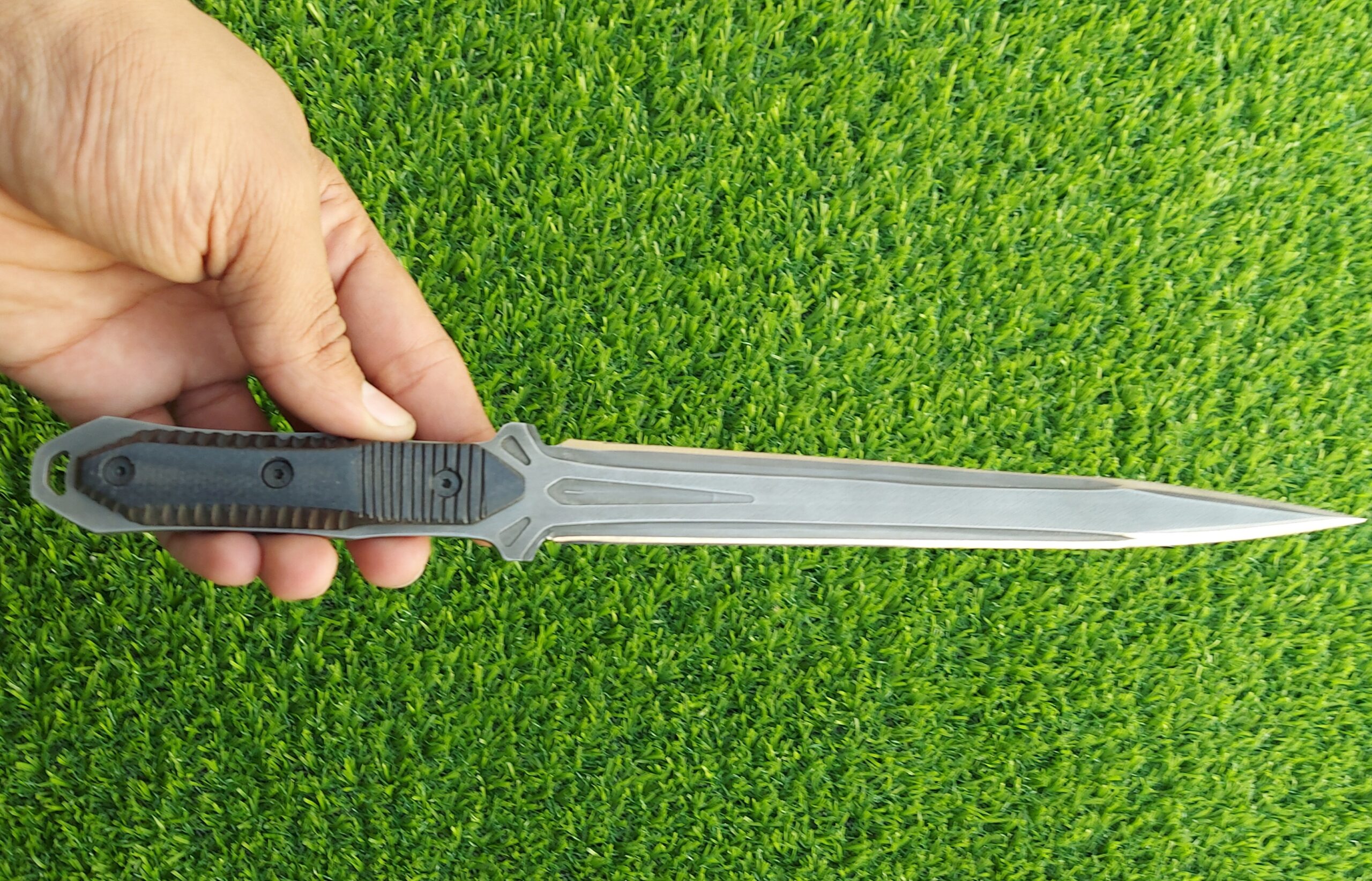 The handmade stainless steel stiletto knife features an intricately acid-washed blade, offering a unique, rugged appearance while maintaining superior sharpness and durability for precise, tactical use. - Image 6