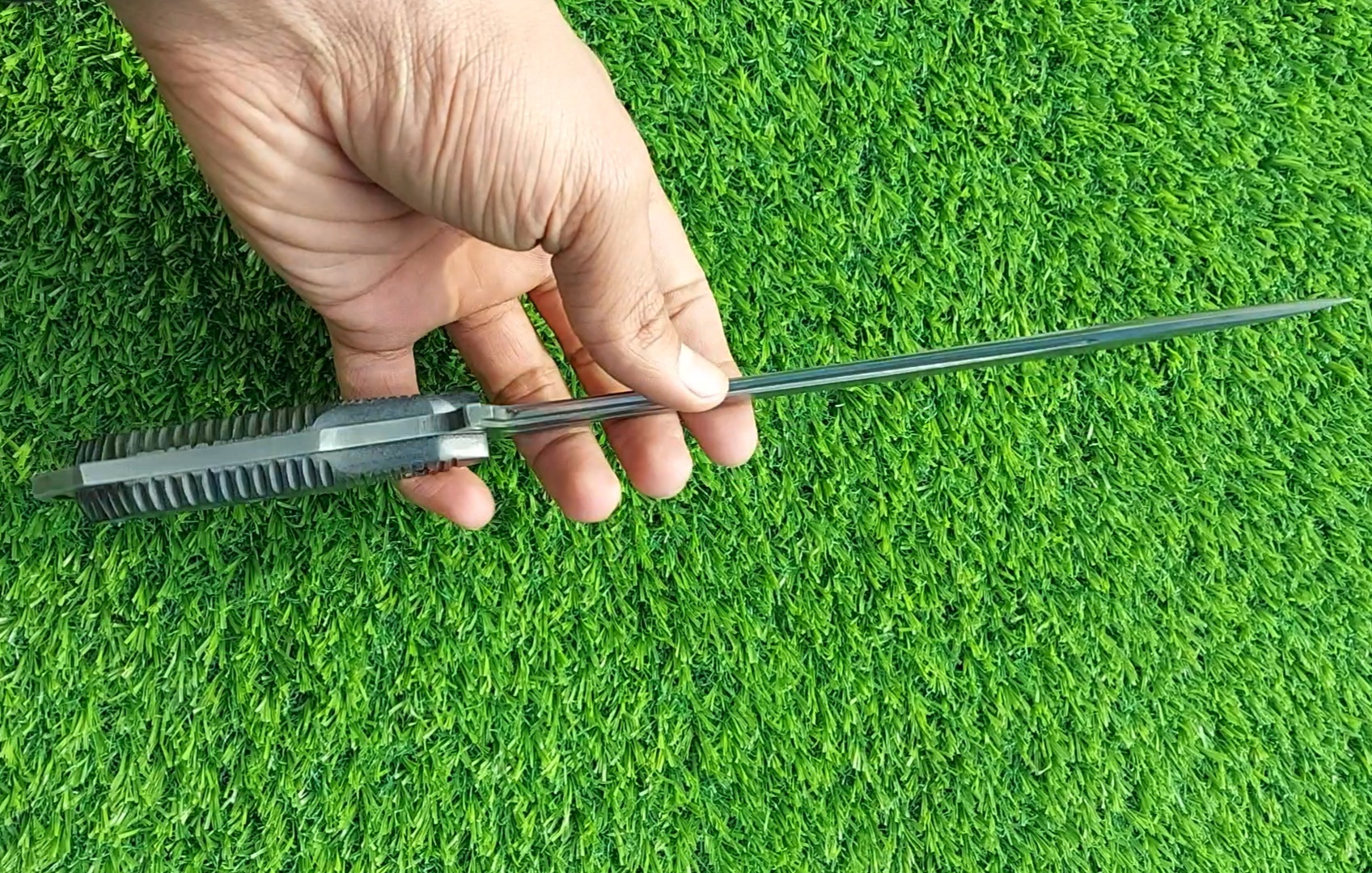 The handmade stainless steel stiletto knife features an intricately acid-washed blade, offering a unique, rugged appearance while maintaining superior sharpness and durability for precise, tactical use. - Image 9