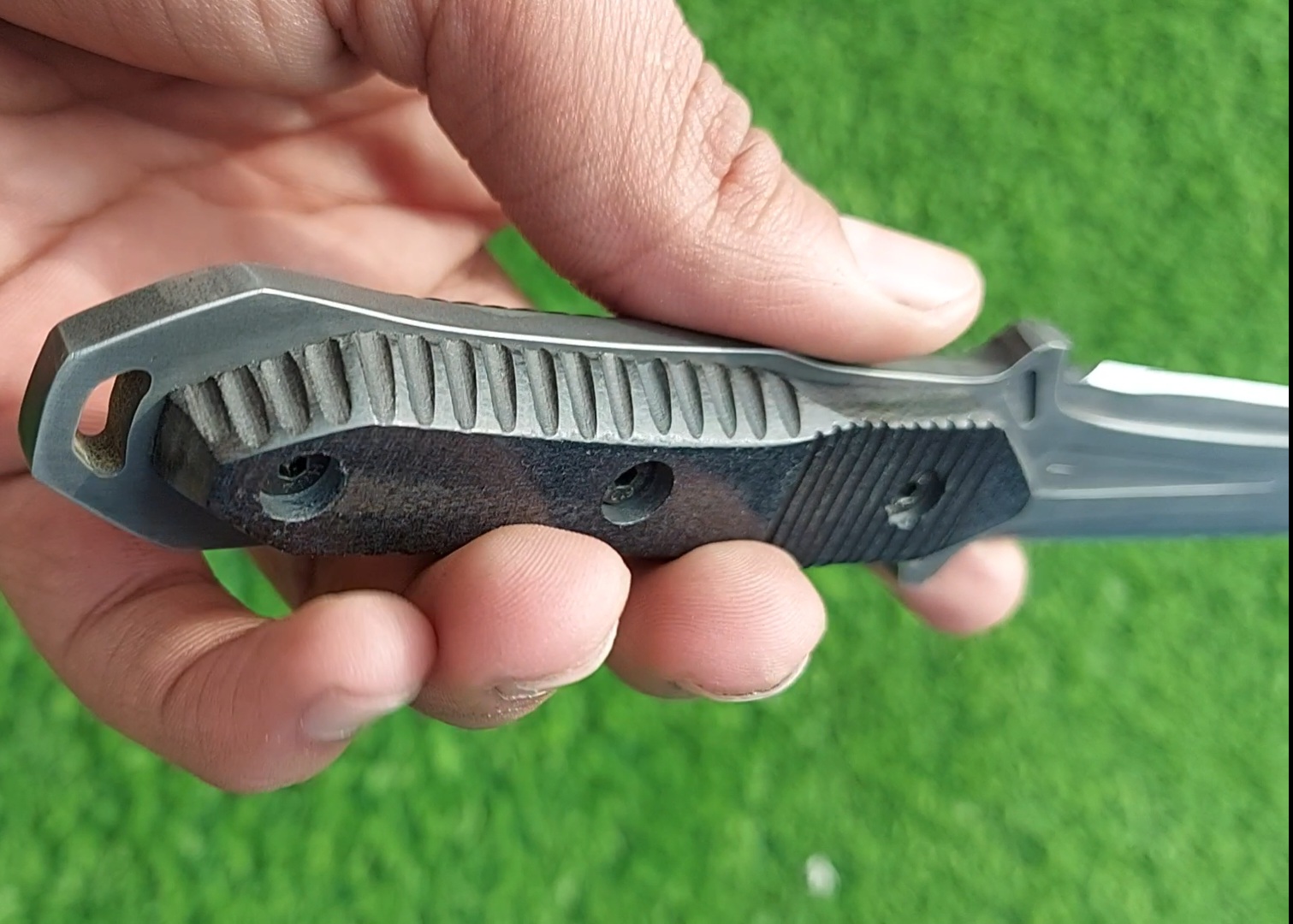 The handmade stainless steel stiletto knife features an intricately acid-washed blade, offering a unique, rugged appearance while maintaining superior sharpness and durability for precise, tactical use. - Image 10