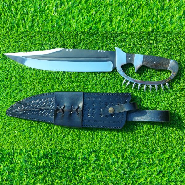 The handmade stainless steel hunting knife features a **D guard** for hand protection and **pins on the guard** for added durability.